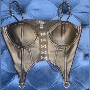 Black Size Medium corset like top. Worn once slight stretch.